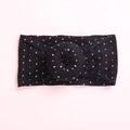 Detail of baby headband featuring soft black fabric with silver grid and donut knot - Black