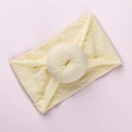 Yellow baby headband with white polka dots and soft knotted bow center detail - Beige