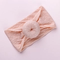 Soft pink polka dot baby headband with a donut knot design for infants and girls - Light Orange