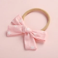 Dettaglio della fascia per neonata rosa con stelle e morbido cinturino in nylon senza cuciture - Stella Rosa