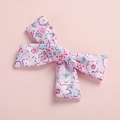 Detailed macro of pink floral pattern on cotton bow hair clip with rustic texture - Hair Bow / Pink Print