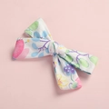 Detailed view of floral printed cotton bow hair clip with colorful flower patterns - Hair Bow / White Floral Print