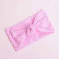 Macro detail of soft pink nylon baby headband featuring a stylish handcrafted central knot - Powder Pink (7)