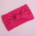 Close-up of bright pink nylon baby headband with a soft knotted rabbit ear design - Rose Red (10)