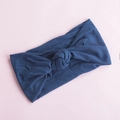 Detail of soft navy blue nylon headband with a classic knot design on a pink background - Ink Blue (16)