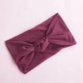 Detailed texture of purple knotted wide nylon headband for babies on pink background - Wine Red (14)