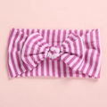 Detailed close-up of pink and white striped baby headband with a large soft bow design - Pink Red Striped