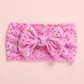 Detailed view of pink baby headband with large bow and cartoon fox prints - Fox Head
