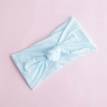 Detail of soft light blue nylon knotted baby headband on a pastel pink background - Sky Blue (20)