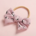 Detailed view of pink corduroy bow with cat print on elastic nylon headband - Red Floral (FHML-0052)