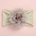 Detailed view of the large layered chiffon flower and soft nylon band for babies - Off-White