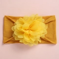 Detailed view of ginger yellow baby nylon headband with a large mesh chiffon flower - Ginger Yellow
