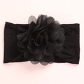 Dettaglio della fascia elastica nera per neonati con grande fiore in rete e glitter - Nero