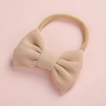 Détail d'un bandeau en velours côtelé pour bébé avec sangle en nylon élastique beige - Abricot (15)