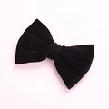 Detail of premium black velvet bow hair clip with a soft texture and elegant finish - Black