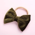 Detail of soft velvet texture and fine stitching on the olive green baby bow headband - Army Green