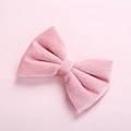 Close-up of pink velvet bow hair clip showing soft fabric texture and elegant sheen - Dusty Pink