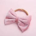 Close-up of soft pink velvet bow baby headband with high elasticity nylon strap - Dusty Pink