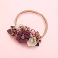Detailed macro view of nylon baby headband with colorful faux fabric flowers and leaves - Deep Purple Pink and White Layered Style (5)