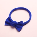 Detailed close-up of a royal blue seamless nylon baby headband with a soft knotted bow - Royal Blue