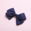 Detailed close-up of navy blue bamboo cotton bow hair clip with textured fabric weaving - Navy Blue