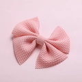 Detail of light pink hair bow with textured fabric and soft embossed pattern - Dusty Pink