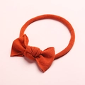 Texture détaillée du bandeau pour bébé en nylon ultra doux orange brûlé avec joli nœud - Rouge Orangé