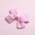 Close-up of pink cotton bow hair clip showing detailed fiber texture and fabric finish - Water Pink