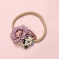 Detail of soft nylon infant headband with dusty pink fabric flowers and realistic leaves - Lotus Pink Layered Fabric Floral (8)