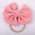 Detail of pink waffle knit texture bow on a high elasticity nylon headband for babies - Pink Waffle Style (#8)