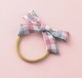Detailed macro of pink and blue checkered fabric bow on a yellow elastic hair band - Pink Blue White Plaid (#13)