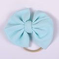 Detail of light blue waffle texture bow headband with highly elastic skin-tone band - Pale Blue Waffle Style (#15)