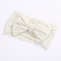 Soft cream nylon headband with large ribbed bow for baby girls and infants - Off-White