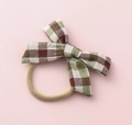 Elastic baby headband with a brown and green plaid fabric bow on a pink background - Brown Green White Plaid (#2)