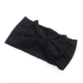 Soft black nylon baby headband with a large elastic bow for infants and toddlers - Black