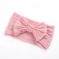 Soft nylon infant headband featuring a large pale pink bow for baby girl hair accessories - Dusky Pink