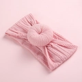Pink cable knit baby headband featuring a soft donut-shaped knot and wide elastic band - Dusty Pink