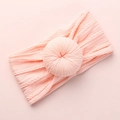 Light pink knitted baby headband featuring a soft donut-shaped knot and textured pattern - Light Pink