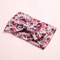 Détail d'un bandeau pour bébé en nylon souple avec nœud bohème fleuri et maille douce - Motif Marguerite