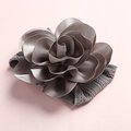 Detailed close-up of a soft grey nylon headband with a layered 3D fabric rose flower - Dark Gray