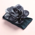 Close-up of baby nylon headband with dark green cable knit texture and satin floral detail - Ink Blue