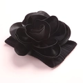 Close-up of a handmade black fabric 3D flower headband with soft nylon ribbed elastic base - Black