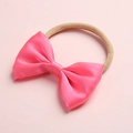 Close-up of bright pink satin bow on elastic beige nylon headband for babies - Bright Pink (12)