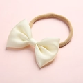 Detailed shot of cream satin bow on soft elastic nylon headband for babies - Cream White (21)