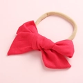 Close-up of baby headband with soft red cotton bow and high elastic nylon band - Red