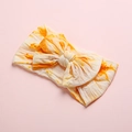 Detailed texture of orange tie-dye nylon baby headband with a large decorative bow - Orange Yellow Tie-dye Style (12)