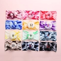Detailed grid of twelve colorful tie-dye baby headbands with soft donut knots - Random Color Selection Style
