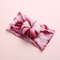 Detailed close-up of baby nylon headband with pink tie-dye donut knot on pink card - Wine Red Tie-Dye Style (6)