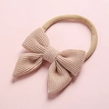 Detail of soft corduroy bow on super stretchy nylon headband for infants and kids - Light Beige (7)