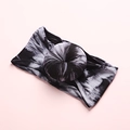 Detail of baby tie-dye nylon headband with central donut knot on a pink background - Black And White Smoke Tie-Dye Style (11)